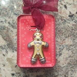 Brighton Retired Gold Gingerbread Man Ornament with Red Ribbon in Tin
